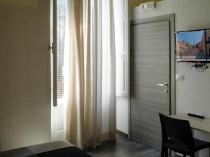 TV a/nebo společenská místnost v ubytování IL TRULLO Modern Rooms