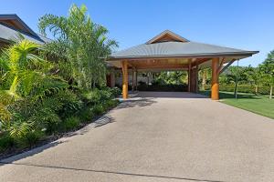 a pavilion in front of a house at Celeste - at Funnel Bay in Airlie Beach