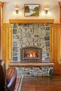 a fireplace with a fire place in it at Tamarack Lodge in Mammoth Lakes