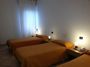 Postel nebo postele na pokoji v ubytování Albergo Pizzeria Sole
