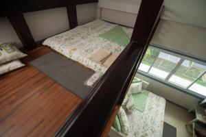 Postel nebo postele na pokoji v ubytování Green Me Organic Farm Stay Khaoyai