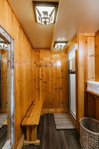 a sauna with a bench in a wooden wall at Tamarack Lodge in Mammoth Lakes