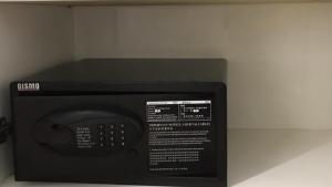 a microwave oven sitting on top of a counter at Otel Hotel Sibu in Sibu