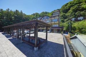 a pavilion in a parking lot in front of a building at Yun Xiang Villa 未接待12歲以下孩童 in Ren'ai