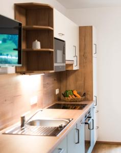 Kuchyň nebo kuchyňský kout v ubytování Gästehaus Erika - by myNests