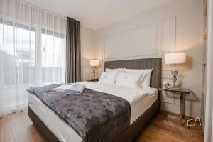 Postel nebo postele na pokoji v ubytování Luxury Villa MetraMaris1
