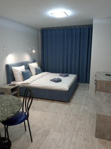 Ένα ή περισσότερα κρεβάτια σε δωμάτιο στο Апартаменты Ужгород