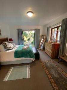 Postel nebo postele na pokoji v ubytování Versteek, Bokkie se le plek