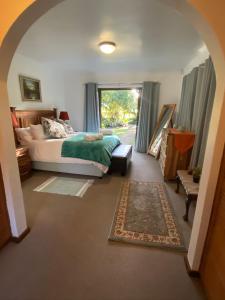 Postel nebo postele na pokoji v ubytování Versteek, Bokkie se le plek