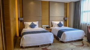 Letto o letti in una camera di Wyndham Jingzhou