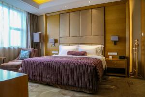 Letto o letti in una camera di Wyndham Jingzhou