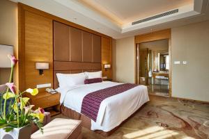 Letto o letti in una camera di Wyndham Jingzhou