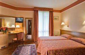 Postel nebo postele na pokoji v ubytování Hotel Astra