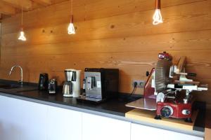 a kitchen counter with a coffee maker on it at Grand chalet Le Trappeur - Chamonix in Chamonix-Mont-Blanc