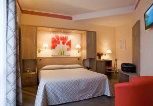 Postel nebo postele na pokoji v ubytování Hotel Astra
