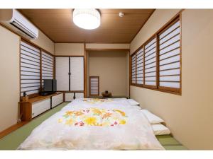 Lova arba lovos apgyvendinimo įstaigoje SYA Hotel-祇園