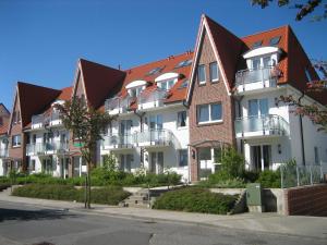 a row of houses with balconies on a street at Haus Duhner Brise, Whg 3, Seesicht in Cuxhaven