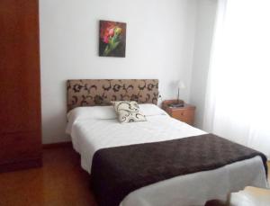 Postel nebo postele na pokoji v ubytování Hotel Abrego Reinosa