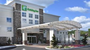 a hospital building with a healthcare sign on it at Holiday Inn Canton-Belden Village, an IHG Hotel in Canton