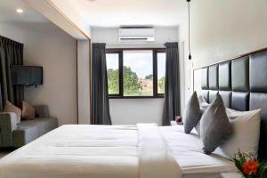 Ένα ή περισσότερα κρεβάτια σε δωμάτιο στο Hotel Mamallaa Heritage +31 φωτογραφίες