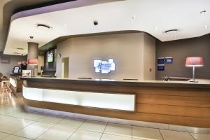 a waiting room at a hospital with a reception counter at Holiday Inn Express Sandton-Woodmead, an IHG Hotel in Johannesburg