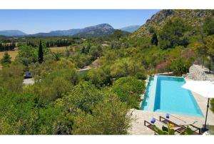 a swimming pool with a view of a mountain at Can Suau Dalt in El Port
