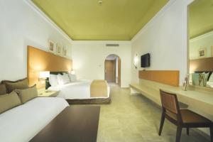 Postel nebo postele na pokoji v ubytování Hotel Riu Tikida Palmeraie - All Inclusive