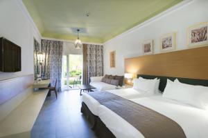 Postel nebo postele na pokoji v ubytování Hotel Riu Tikida Palmeraie - All Inclusive