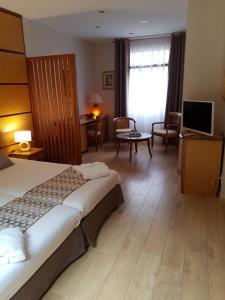 Postel nebo postele na pokoji v ubytování Hotel Eden