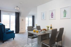 a dining room with a table and chairs at Aura Retreat with Free Parking in York