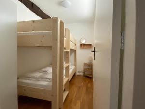 a room with two bunk beds and a hallway at Authentic Stays - 6p-maisonette in Eijsden