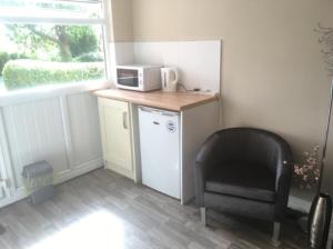 Η κουζίνα ή μικρή κουζίνα στο Cosy annex. +3 φωτογραφίες