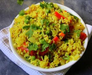 a plate of rice with vegetables on a table at Lakeview Resort Lavasa in Lavasa