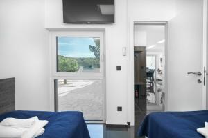 Postel nebo postele na pokoji v ubytování Alexandra Apartments