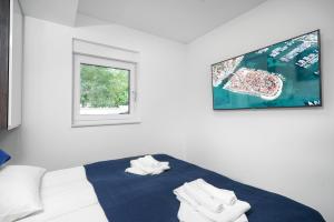 Postel nebo postele na pokoji v ubytování Alexandra Apartments