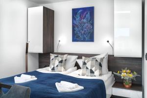 Postel nebo postele na pokoji v ubytování Alexandra Apartments