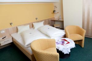 Posteľ alebo postele v izbe v ubytovaní Hotel Garni Burger