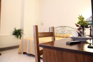 A bed or beds in a room at Hotel I Platani