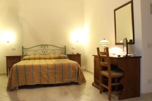 A bed or beds in a room at Hotel I Platani