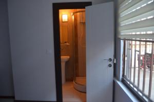 an open door to a bathroom with a toilet at Grand Antalya Hotel in Antalya