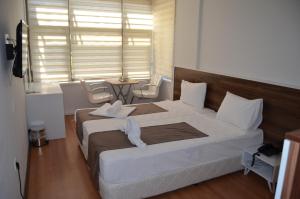 Ένα ή περισσότερα κρεβάτια σε δωμάτιο στο Grand Antalya Hotel +20 φωτογραφίες