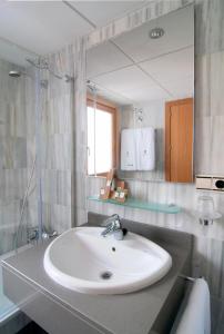 a bathroom with a sink and a mirror at Villa Turística de Laujar de Andarax in Laujar de Andarax