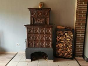 a large wooden cabinet next to a pile of wood at Haus Froehlich in Michelstadt