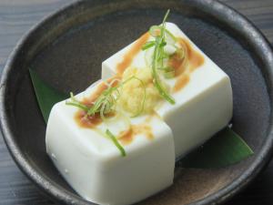 a plate of food with cheese and vegetables on it at Daiwa Roynet Hotel Sakai Higashi in Sakai