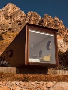 a building with a window with a person in it at Container Suite in Terrasini