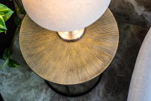 a close up of a table with a lamp at Toboso Apar - Turis in Nerja