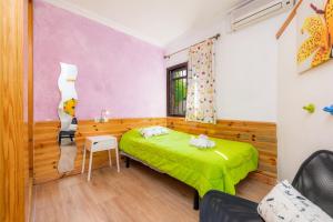 Posteľ alebo postele v izbe v ubytovaní Casa Paqui Alcudia