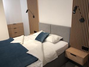 Posteľ alebo postele v izbe v ubytovaní Apartament Lena Stare Miasto