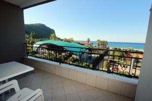 a balcony with a view of the ocean at Havana Apart Hotel in Alanya