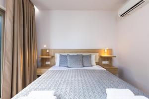 Postel nebo postele na pokoji v ubytování Gorgona Hotel